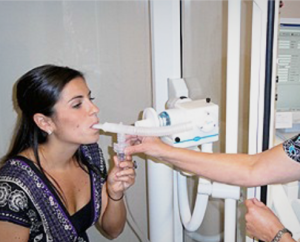 nurse performing some breathing exam